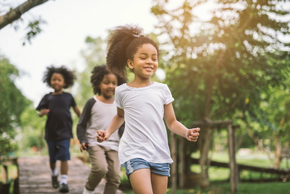 Children Running Through the Park