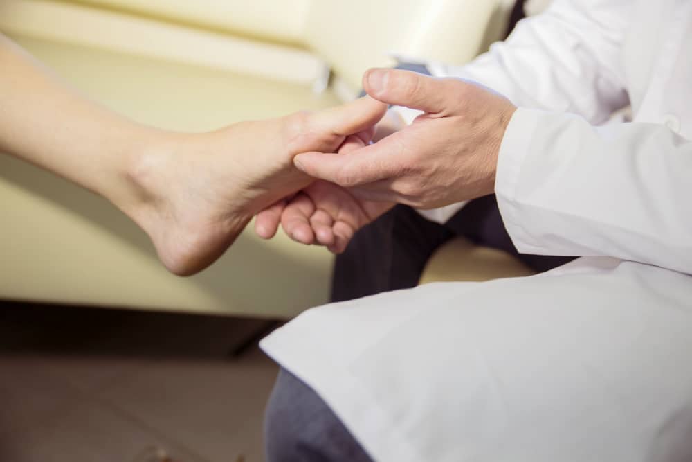 Doctor Inspecting a Bunion Foot